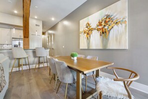 Cook and dine easily in the fully stocked kitchen, equipped with all stainless steel appliances, gas range, basic cookware, and a dining area for a comfortable meal at home. Entertain at the bar with seating for four.
