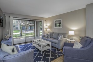 Plenty of comfortable seating for all in the great room and a queen sleeper sofa - sliders lead to the patio