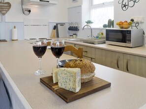 Fully appointed fitted kitchen with breakfast bar | The Loft - Ty Copr, Pen-y-Sarn, near Amlwch