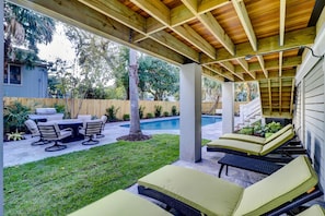 Lounge poolside on the covered patio.  Lots of porches and decks to choose from.