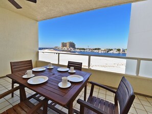 Covered Balcony with dining table and sweeping views!