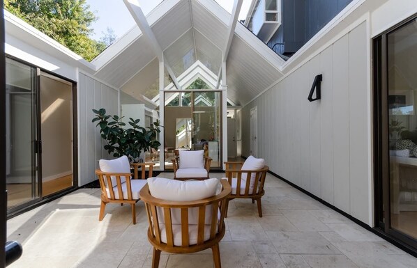 A view from inside with the atrium open on a sunny day in Palo Alto