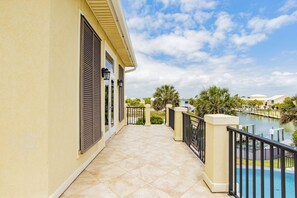 View of the water from the upper level porch, doors lead to the pool table room