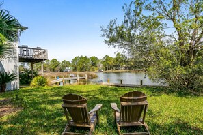 Surrounded by nature, watch the action at the pier from the shade