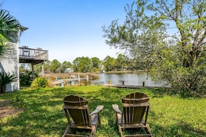 Surrounded by nature, watch the action at the pier from the shade