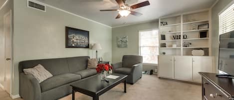 Our living room features modern furniture, HDTV, Netflix, and more!