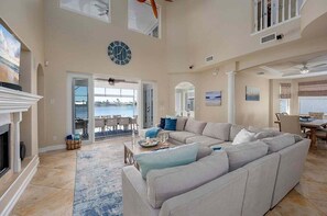 Living Room With Large L-Shape Couch and Smart TV