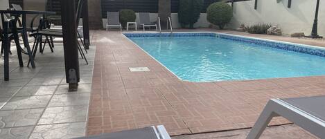 large swimming pool and patio