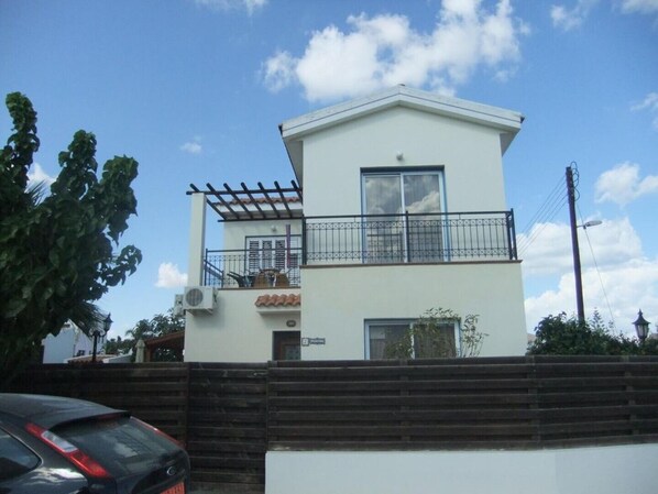 Artemis three bed villa , front view showing large balcony and Juliet balcony