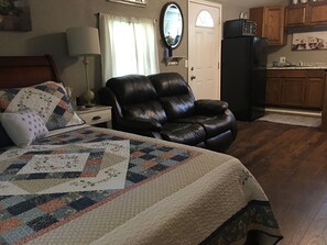 Full sized sleigh bed and double recliner.