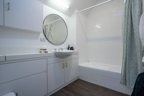 Bathroom with shower over bathtub