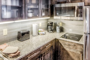 Prepare meals in the kitchen