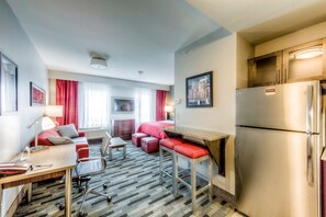Relax in the living area featuring a flat screen TV and sleeper sofa