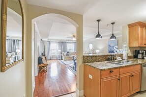 Kitchen leading into dining area and living room