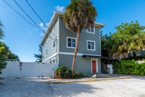 From the outside there are three parking spots in front of the clean and beachy condo