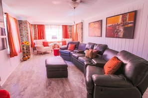 The home has several separate seating areas & places for guests to gather.