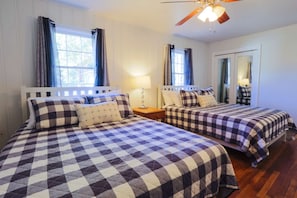 This lovely bedroom feaures two queen size beds.