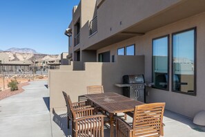 Back Patio Area - BBQ your favorite dish and enjoy dinner outside on this gorgeous outdoor dining table.