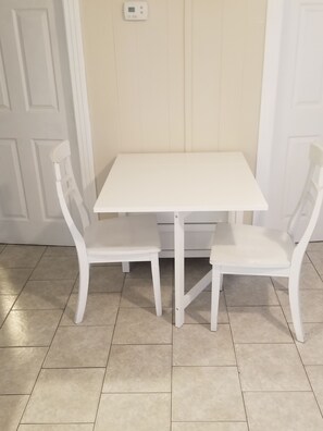 Dining room table opens to seat 6 or folds down flat.
