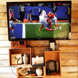 Catch your fave shows or sporting events on the large screen TV.