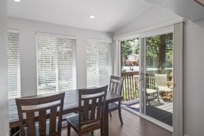 Dining area with access to the upstairs deck