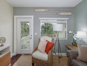 View of the living area - door opens up to the unit's private balcony.  Enjoy your morning coffee or evening cocktail while watching the boats go by.