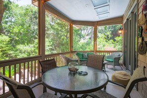 Dine al fresco on the screened porch off of the living room and den.
