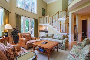 This grand home features a separate living room, den and family room.