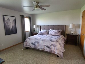 King bedroom with ceiling fan, walk in closet, 43 inch Smart TV