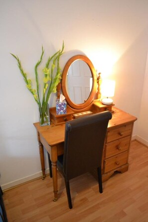 bedroom dressing table with fresh flowers