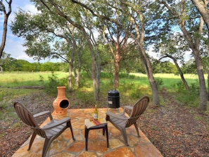 Patio area with chiminea and grill
