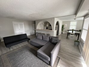 Living room with flat tv sectional and futon sofa bed