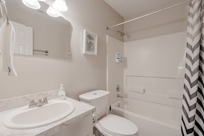 Full bathroom with a shower/tub combo