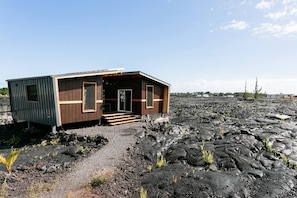 The view of Ohana House situated on the Kalapana lava beds near the base of the Kilauea Volcano.