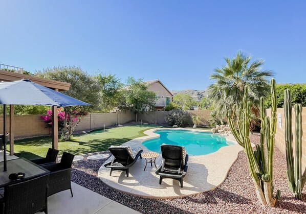 Beautiful backyard with a professional putting green