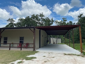 We have a newly added 1000 sq ft covered car port to park under