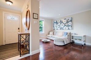 Living room at the front of the home. Large front hall closet for your coats.