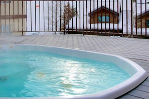 Take a soak in the community hot tub after a long day adventuring!