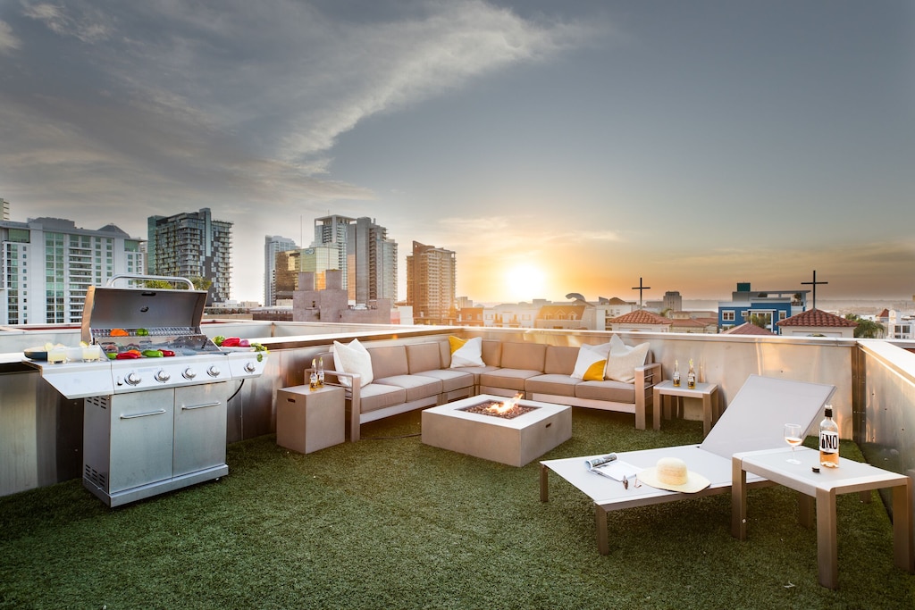 This incredible private rooftop features a BBQ and fire pit.