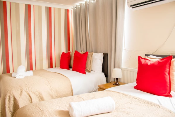 Bedroom 1- an en-suite which includes a double bed and a single bed