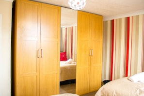 Bedroom 1- an en-suite which includes a double bed and a single bed
