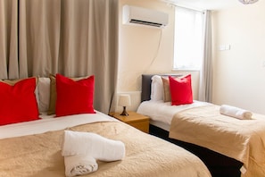 Bedroom 1- an en-suite which includes a double bed and a single bed