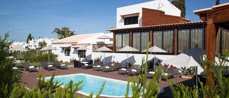 Relax while lounging around the on-site outdoor pool.