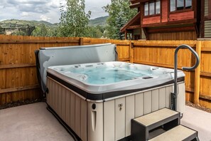 Enjoy the private hot tub all year long