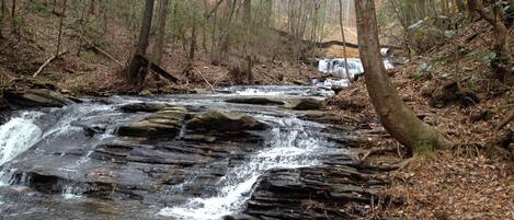 Hike down the rear of the property to this beautful water fall. 