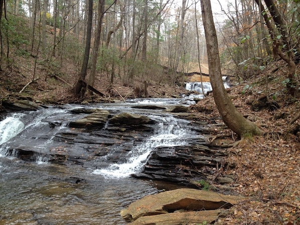 Hike down the rear of the property to this beautful water fall. 