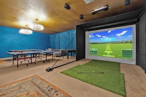 Experience the ultimate hangout space featuring a state-of-the-art golf simulator, perfect for practicing your swing or hosting a friendly competition. 