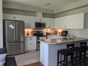 Spacious kitchen accompanied with an island counter