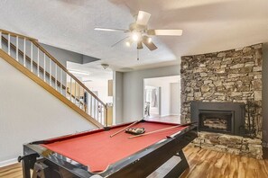 Apartment- Game area.  Pool table, turns over to air hockey table.  Foosball table (not in photo). Fire place.