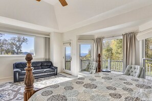 Master bedroom w/ bath en-suite. Two sitting areas and a private entrance to the deck with a view.  